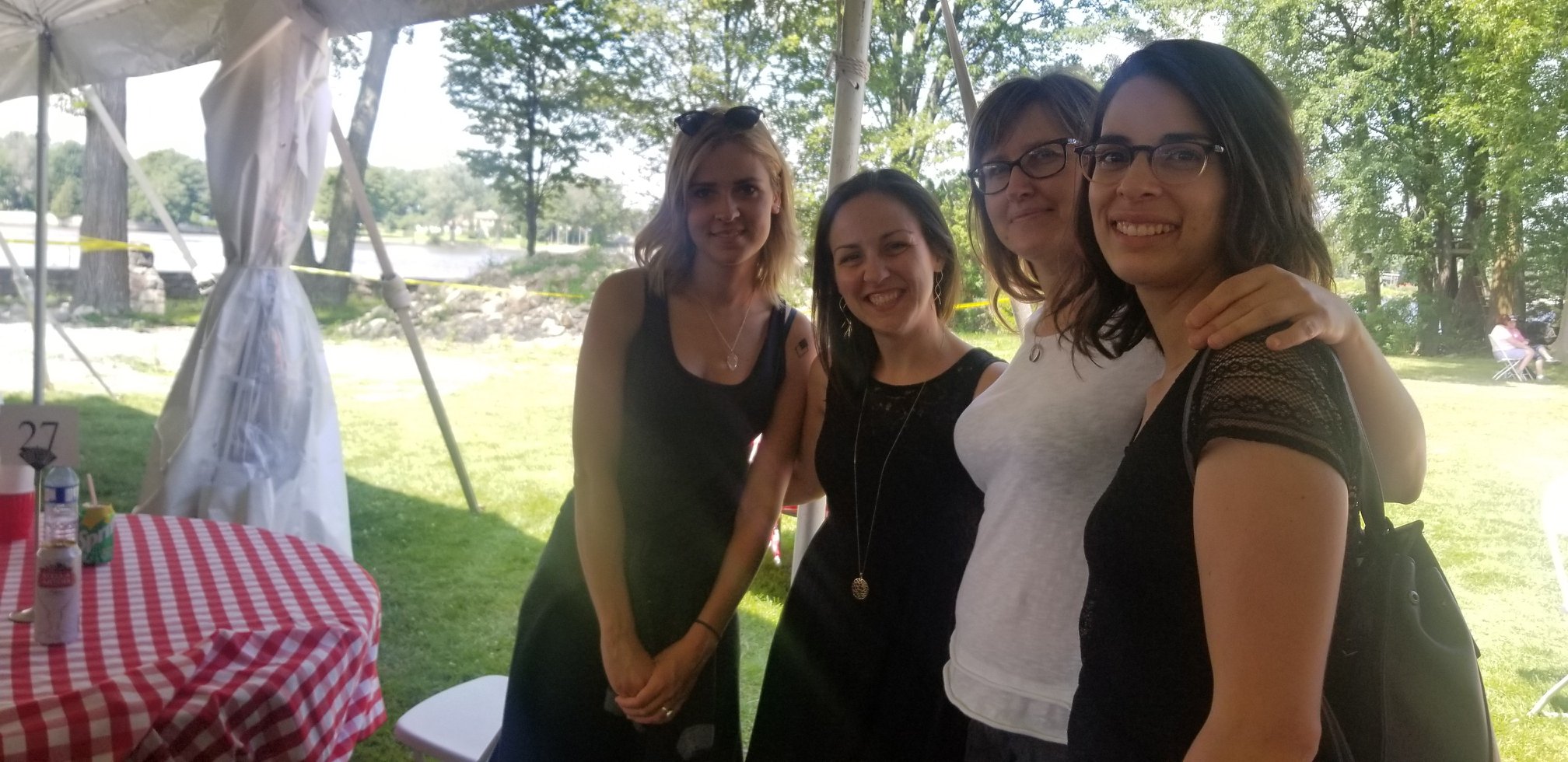 Community members enjoying fellowship at a picnic table