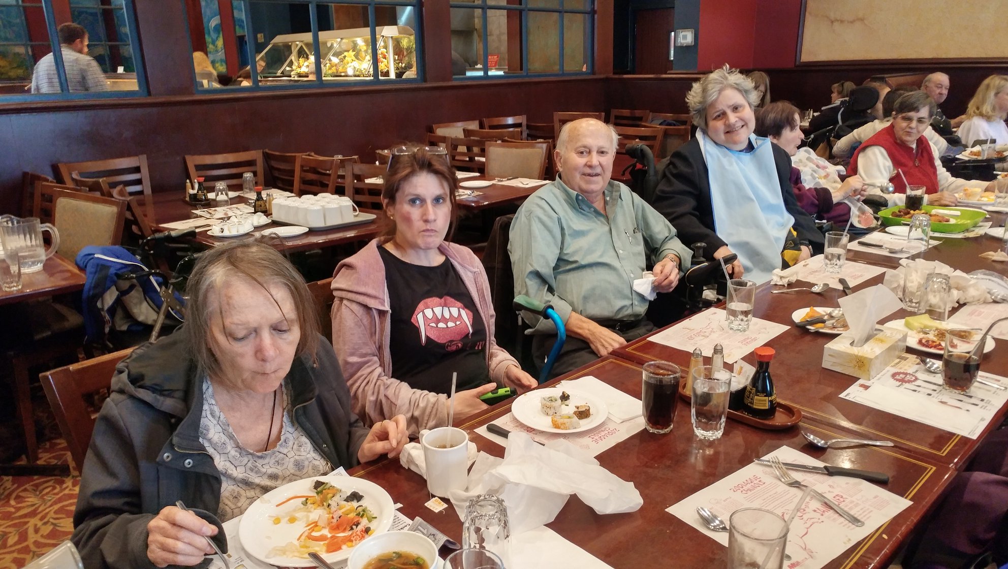 Large group community meal at a restaurant